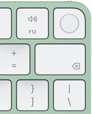 Magic Keyboard, obere rechte Ecke, Farbe Grün, Touch ID, Löschtaste und Funktionstasten für die Lautstärke